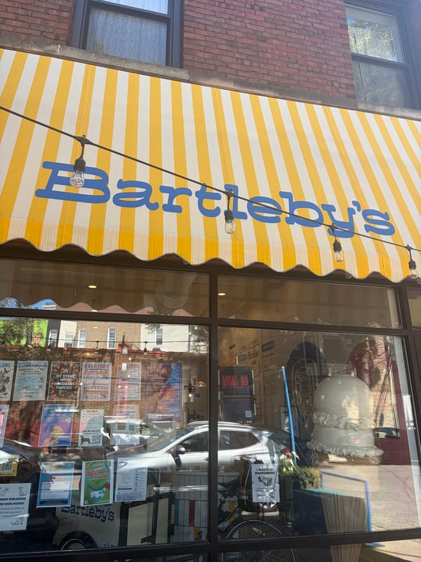 Bartleby’s Ice Cream storefront with its yellow-and-white striped awning in Chicago.