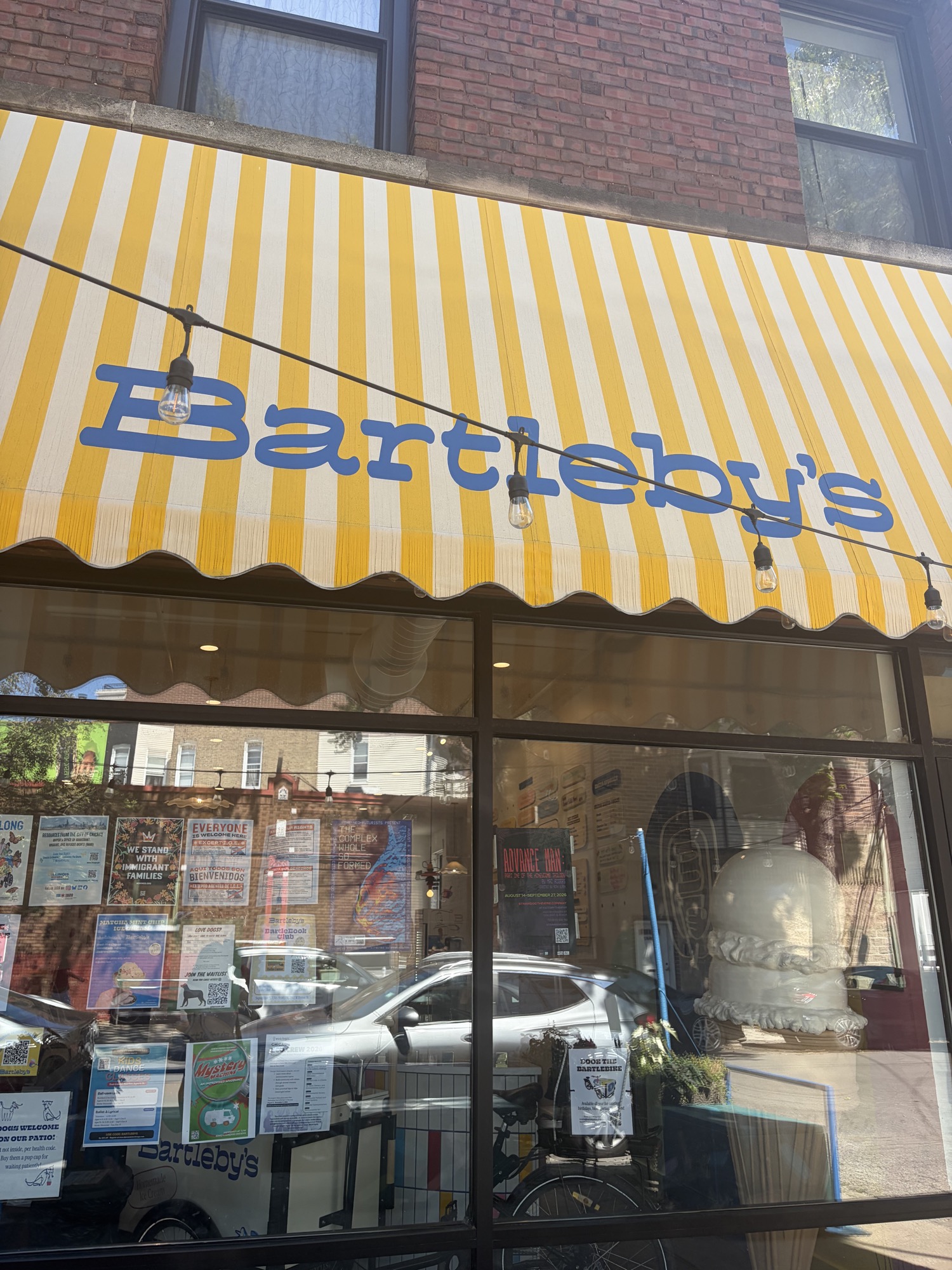 Bartleby’s Ice Cream storefront with its yellow-and-white striped awning in Chicago.