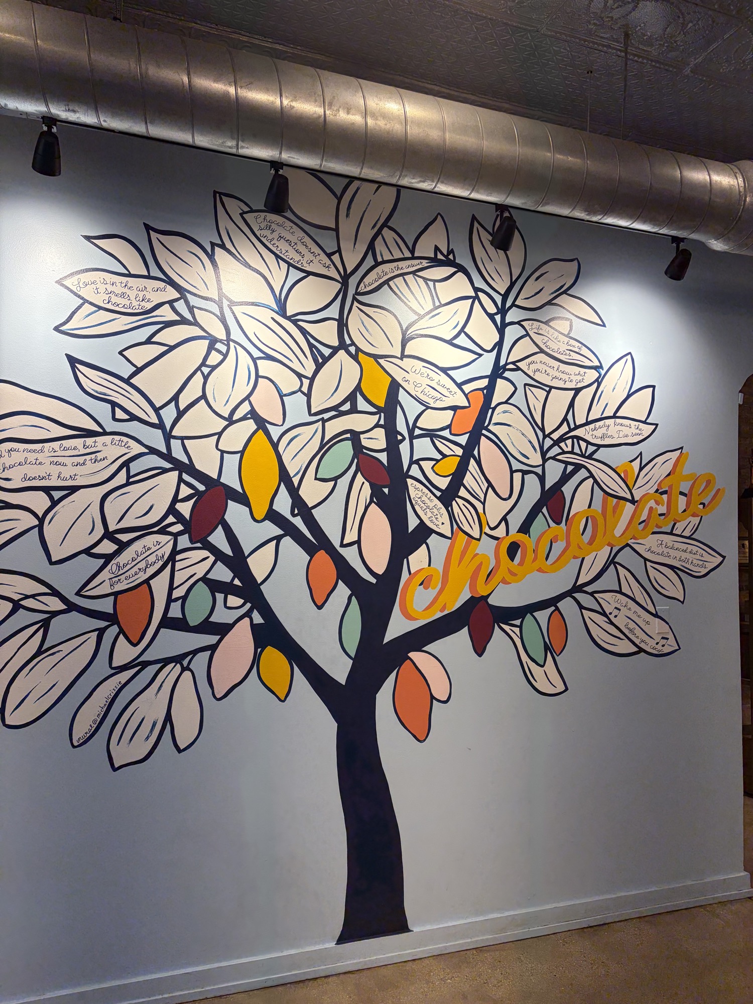 Colorful cacao tree mural at Katherine Anne Confections.